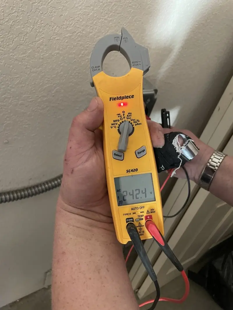 Voltage testing with clamp meter during Hot Tub / Pool Electrical Wiring in Harrison